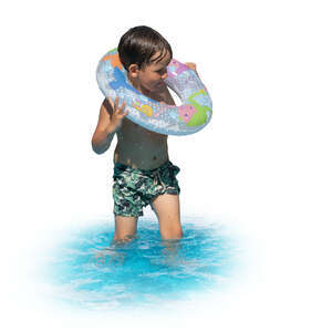 little boy with a swim ring standing in the water