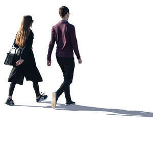 two young people walking with backlit light