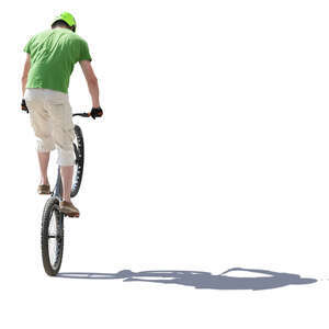 young man doing a stunt on a bike