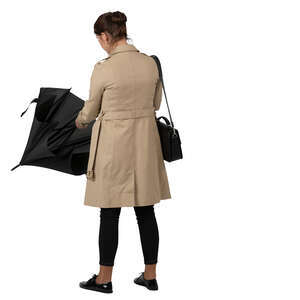 woman standing and opening an umbrella