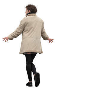 woman in a beige overcoat leaning on a railing