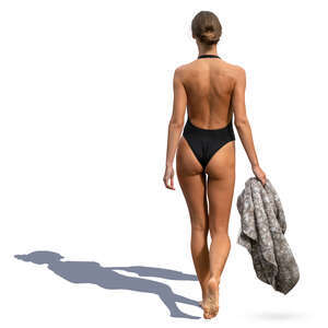 woman in a black bathing suit walking