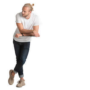 man standing and leaning on a table