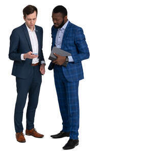 two men in suits standing and looking smth from a phone