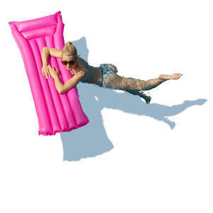 woman swimming in a pool with a swim mattress