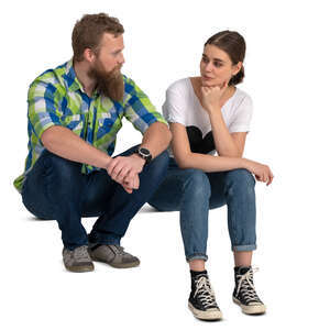 two people sitting on stairss and talking
