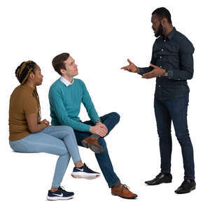 group of three adults sitting and talking
