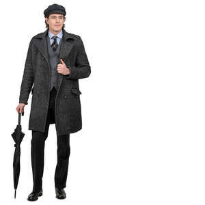 man in a grey overcoat and umbrella standing