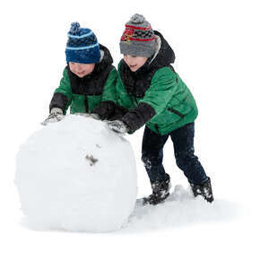two boys building a large snowball