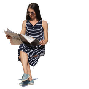 woman sitting and reading a newspaper