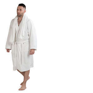 man in a white bathrobe walking