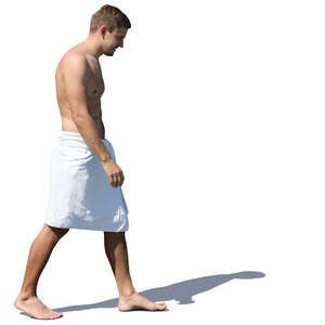 man in a white towel walking