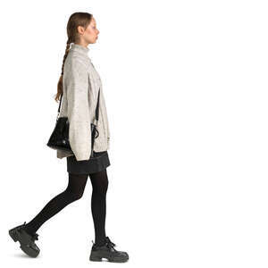 woman in a loose white sweater walking