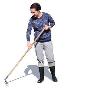 woman raking in the garden