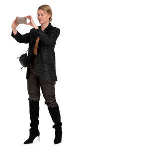 woman in a black costume taking a picture