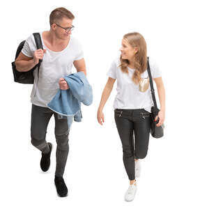 young cheerful man and woman walking seen from above 
