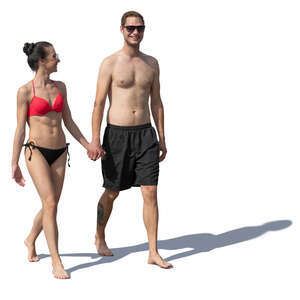 happy couple on the beach walking hand in hand