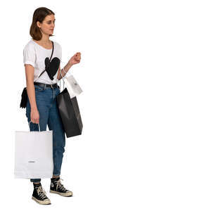 woman with many shopping bags standing