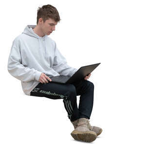 young man with a laptop sitting on a bench
