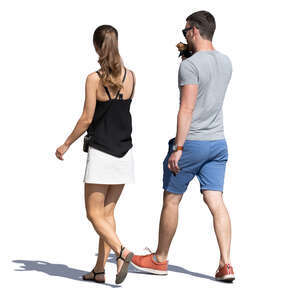man and woman walking and eaitng ice cream
