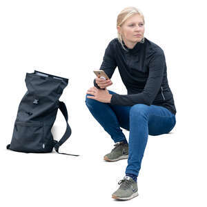 woman sitting on the stairs with a phone in her hand