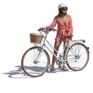 woman with a helment standing by a bicycle