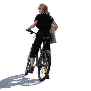 backlit woman riding a bike stopping for a while