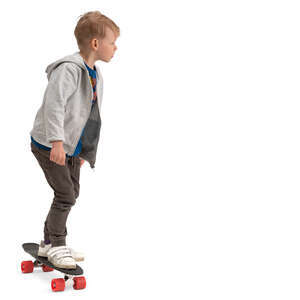 little boy riding a skateboard