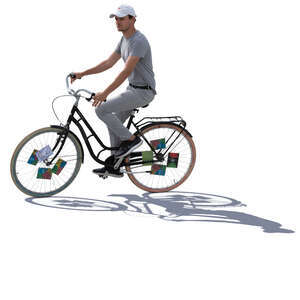 backlit young man riding a bike