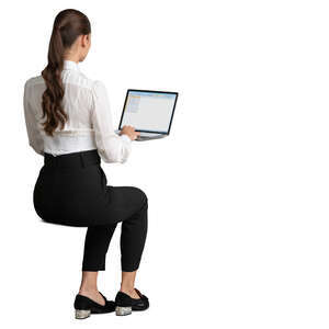 young woman sitting at an office table and working