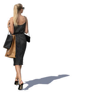 woman with shopping bags walking in sunlight