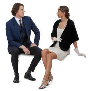 man and woman sitting and talking at a party