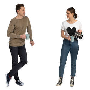 man and woman standing in a kitchen and drinking coffee