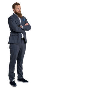 man in a suit standing hands on his chest