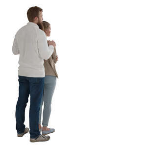 couple standing by the window and looking out