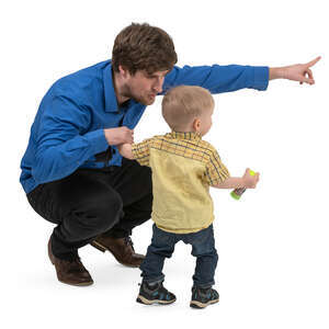 father squatting and talking to his little son