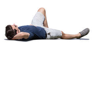 man lying on the ground in the sun