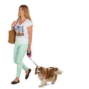 young woman with a dog walking