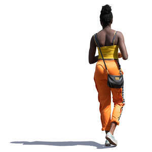 sidelit black woman walking on a summer day
