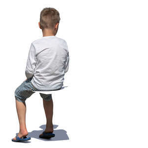little boy sitting in sunlight