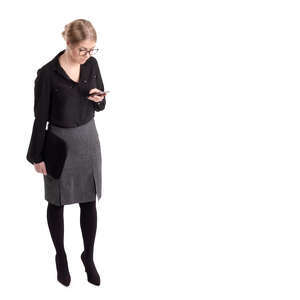 office worker standing and looking at her phone seen from above