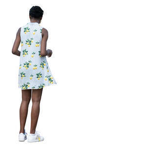 woman in a mini summer dress standing