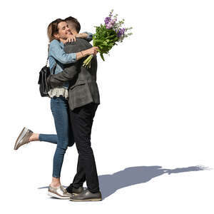 man and woman standing and hugging