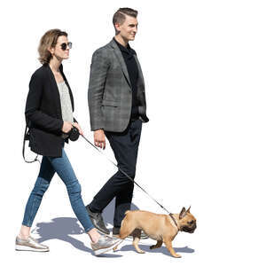 man and woman with a dog walking