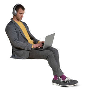 cut out man with headphones and a laptop sitting