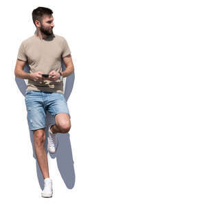 cut out man leaning against the wall on a sunny day