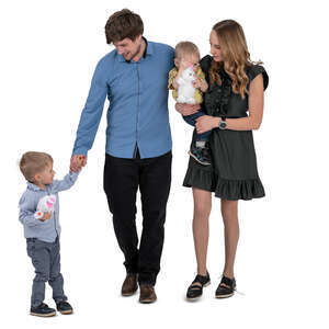 family with two little boys walking hand in hand