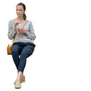 cut out woman sitting and sipping some juice