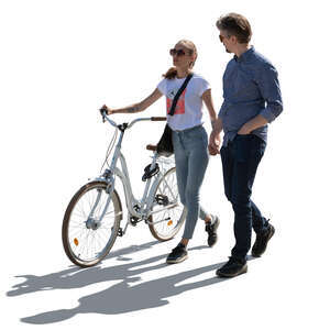 cut out backlit couple with a bicycle walking hand in hand