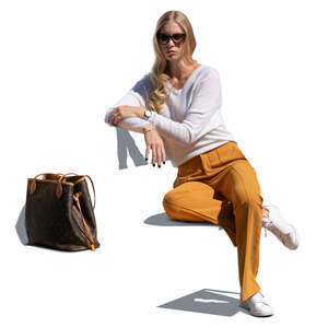 cut out woman sitting on a bench and leaning against the backrest